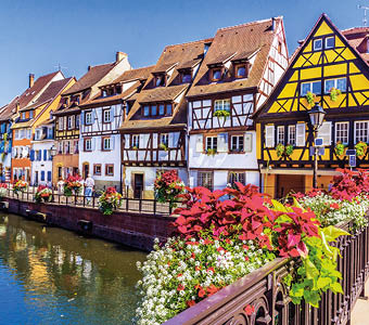 Colmar, Alsace, France. Petit Venice, water canal and traditional half timbered houses.