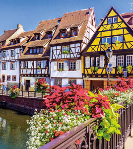 Colmar, Alsace, France. Petit Venice, water canal and traditional half timbered houses.