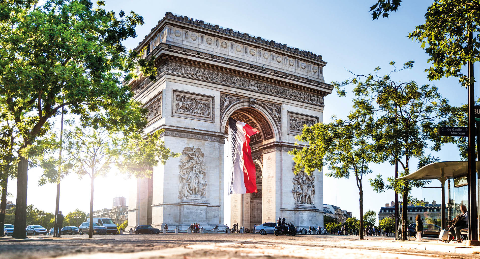 View of Paris Arc de Triomphe at night during the 14th of July, National Holiday.