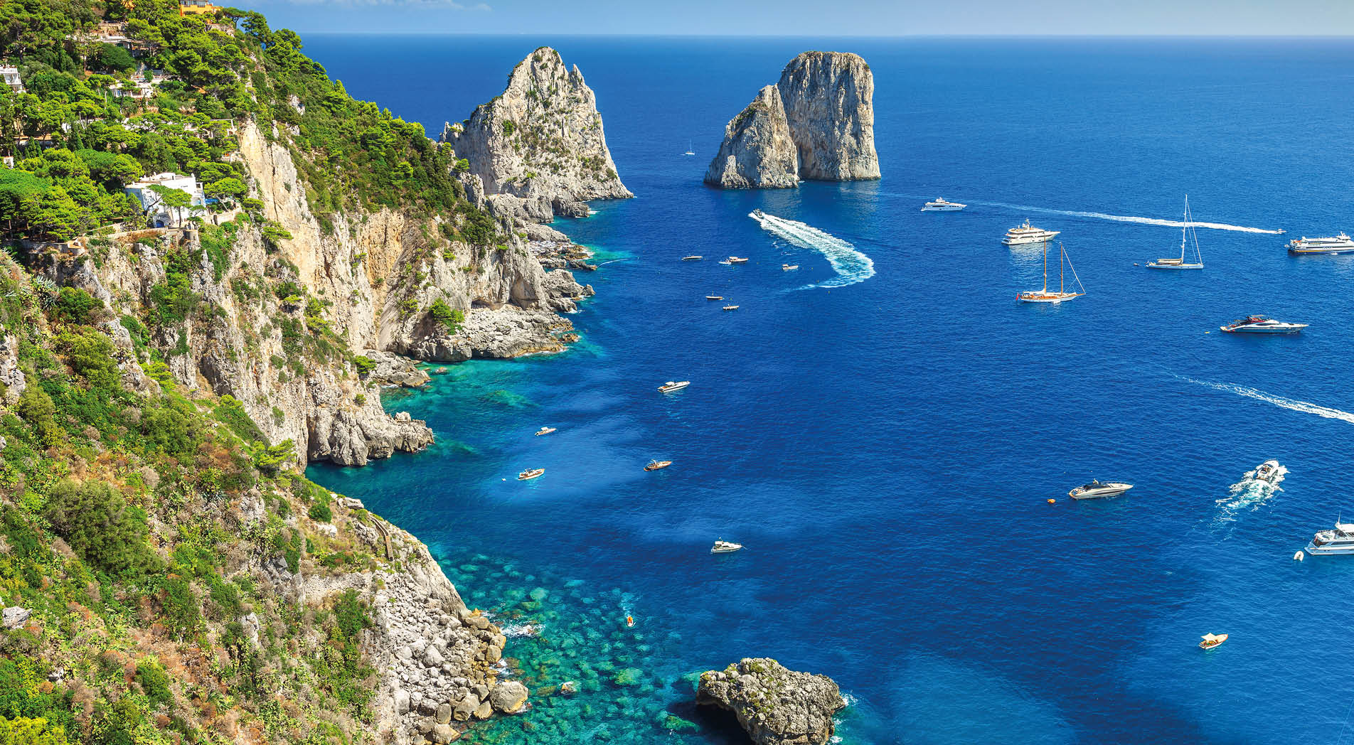 Amazing Faraglioni cliffs panorama with the majestic Tyrrhenian sea in background, Capri island, Campania region, Italy, Europe