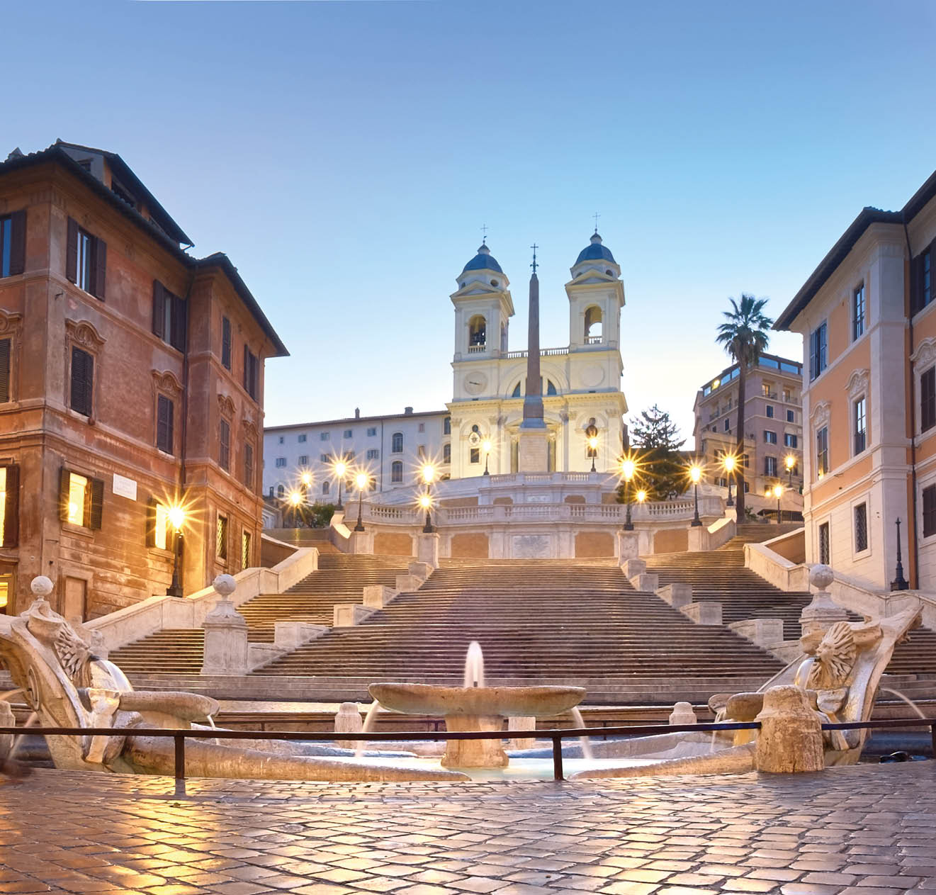 Spanish Steps and a boat-shaped fountain on Piazza di Spagna in Rome, Italy. Early morning panoramic shot after rain.