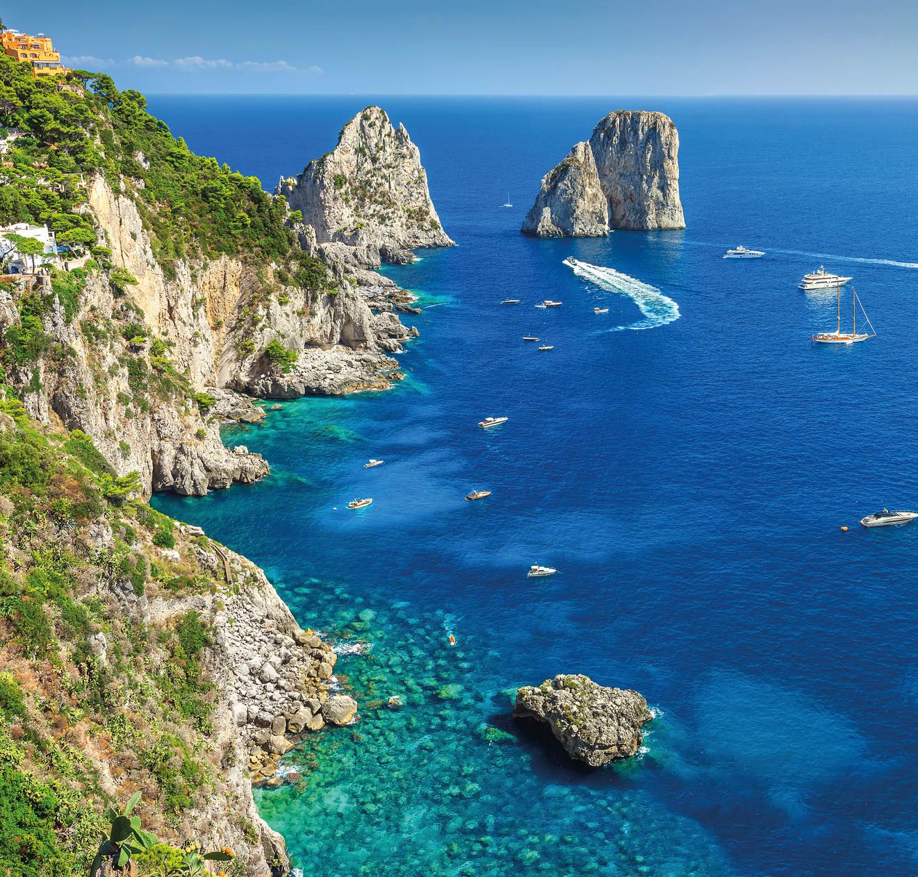 Amazing Faraglioni cliffs panorama with the majestic Tyrrhenian sea in background, Capri island, Campania region, Italy, Europe