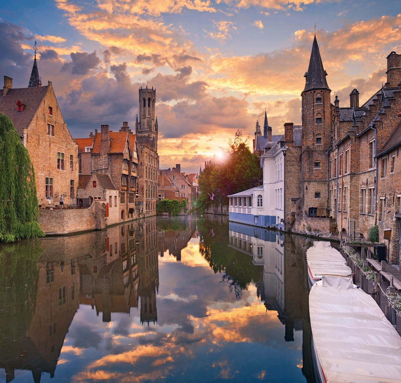 Image of famous most photographed location in Bruges, Belgium during dramatic sunset.