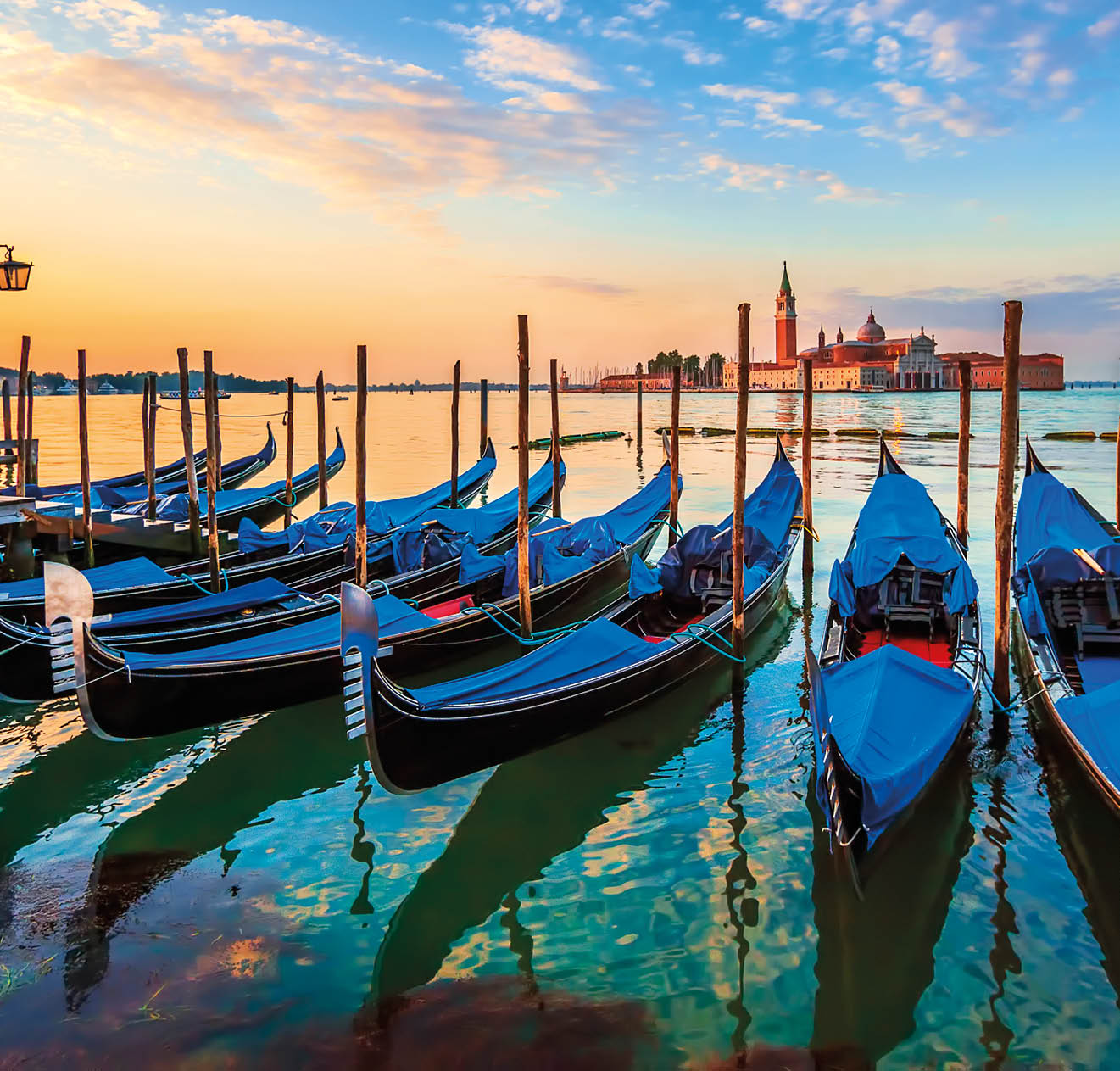 Venice with famous gondolas at sunrise, Italy