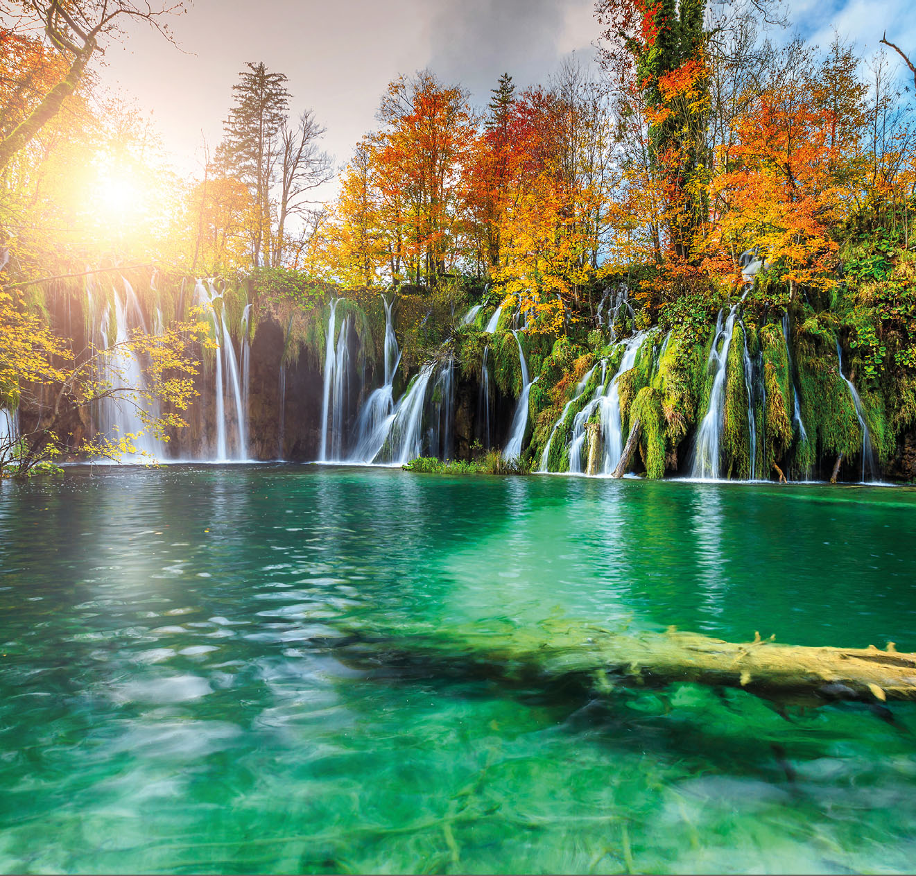 Stunning colorful autumn landscape with spectacular lake and waterfalls in Plitvice lakes National Park, Croatia, Europe