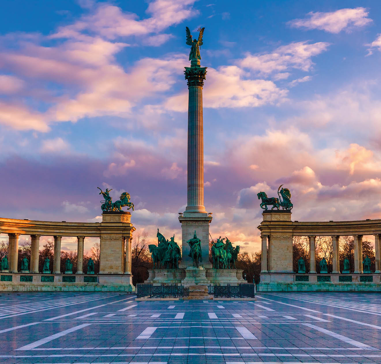 Heroes Square Budapest in morning. The square is the end of Andrassy Avenue, this street is part of Unesco World Heritage. This photo was made after a rain, the reflection is real, not composit image.