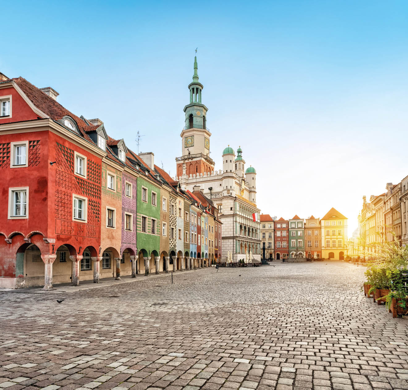 Stary Rynek square with small colorful houses and old Town Hall in Poznan, Poland