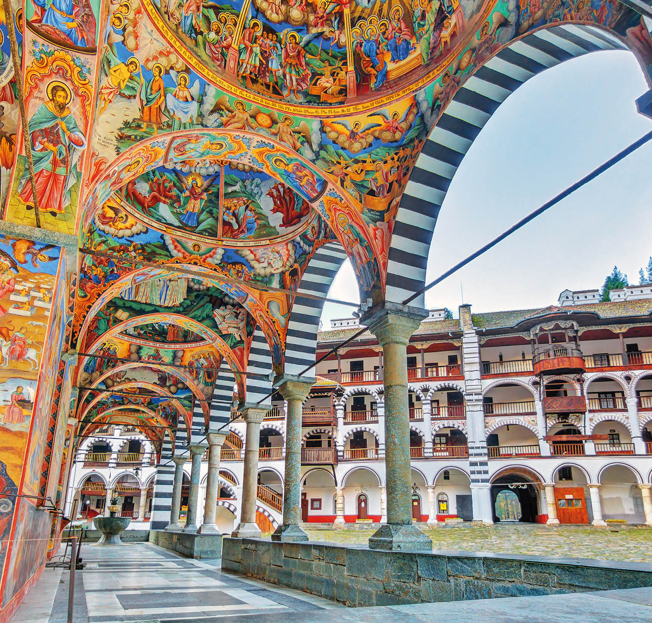 Beautiful view of the vibrant decoration of the Orthodox Rila Monastery, a famous tourist attraction and cultural heritage monument in the Rila Nature Park mountains in Bulgaria