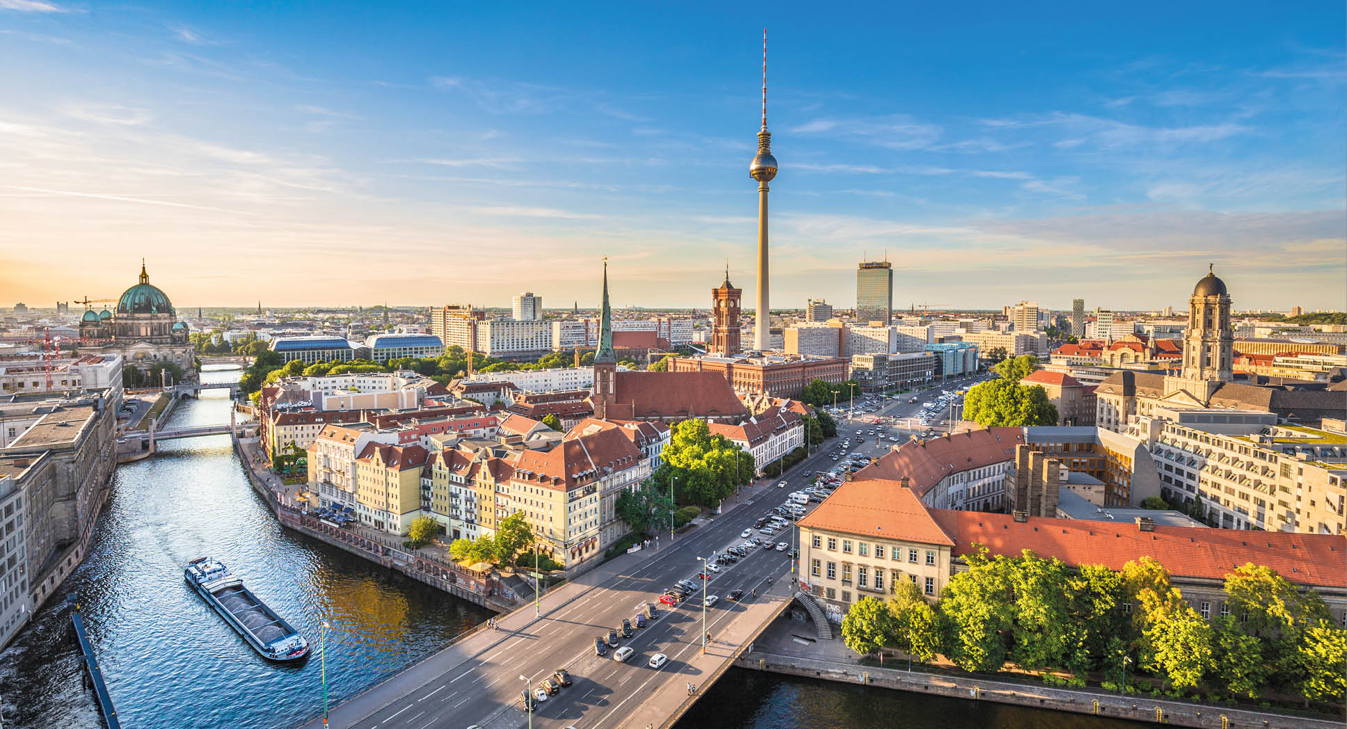 Aerial view of Berlin skyline with famous TV tower and Spree river in beautiful evening light at sunset, Germany