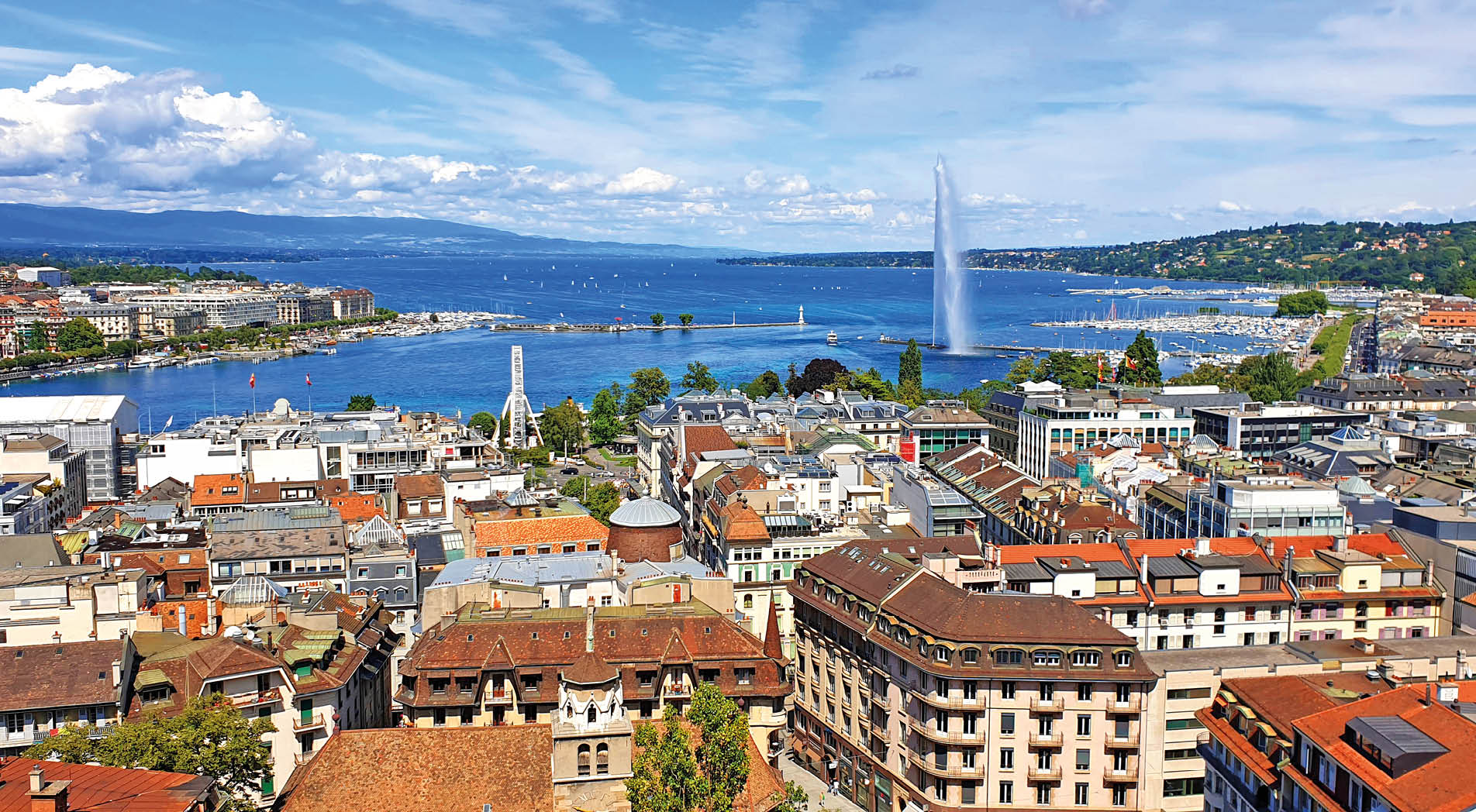 Aerial view of Geneva, Lake Geneva with famous fountain. Photo taken from Geneve Cathedral.