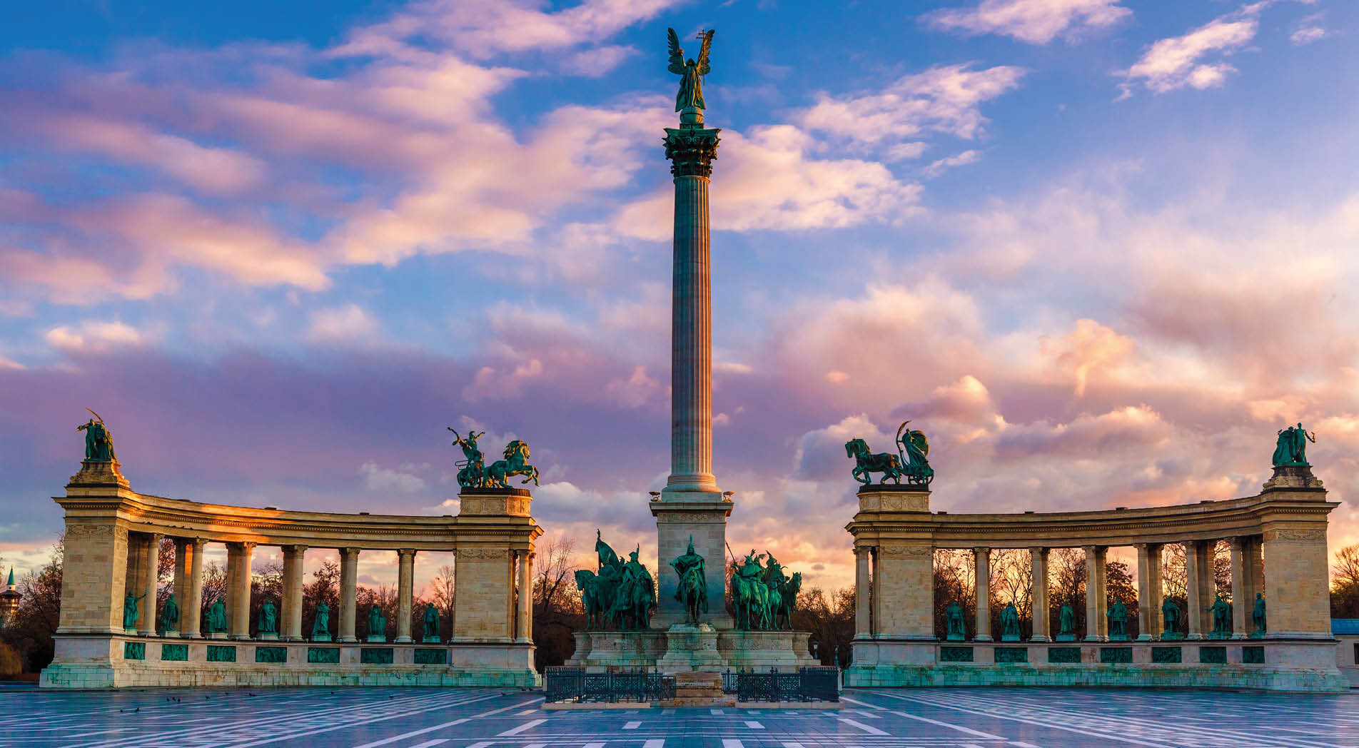Heroes Square Budapest in morning. The square is the end of Andrassy Avenue, this street is part of Unesco World Heritage. This photo was made after a rain, the reflection is real, not composit image.