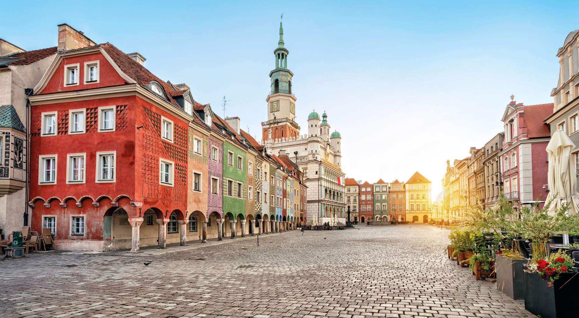 Stary Rynek square with small colorful houses and old Town Hall in Poznan, Poland