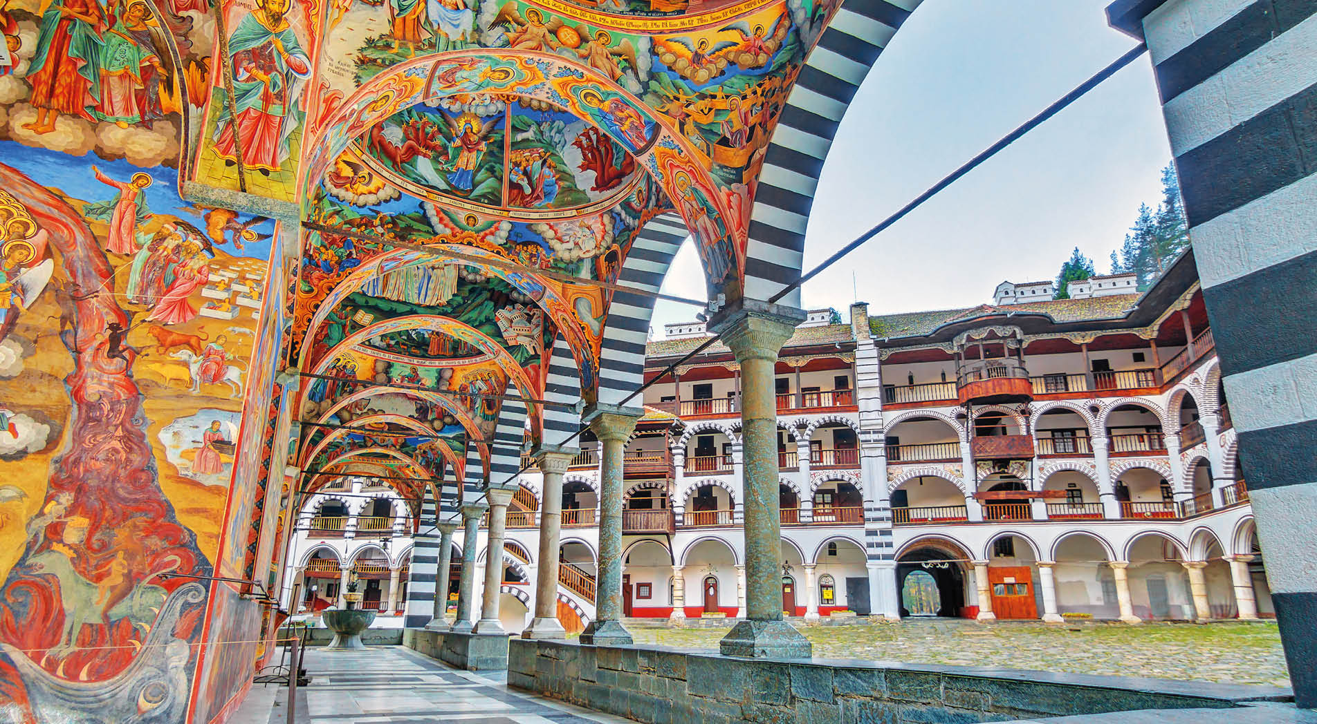 Beautiful view of the vibrant decoration of the Orthodox Rila Monastery, a famous tourist attraction and cultural heritage monument in the Rila Nature Park mountains in Bulgaria