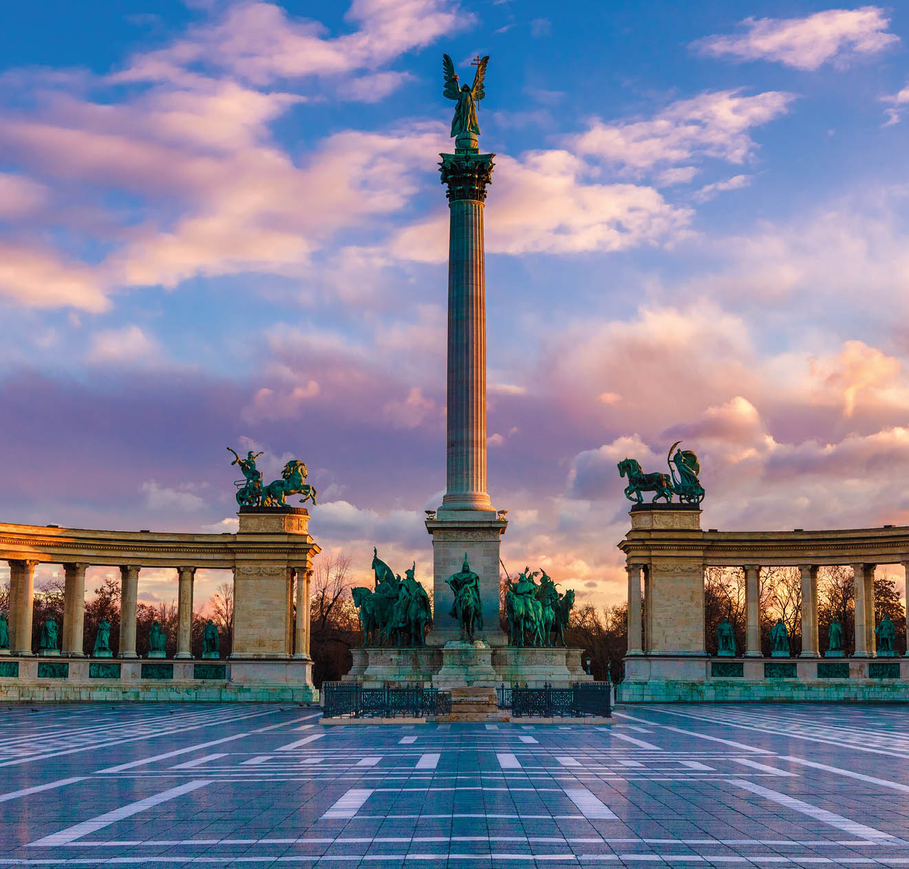 Heroes Square Budapest in morning. The square is the end of Andrassy Avenue, this street is part of Unesco World Heritage. This photo was made after a rain, the reflection is real, not composit image.
