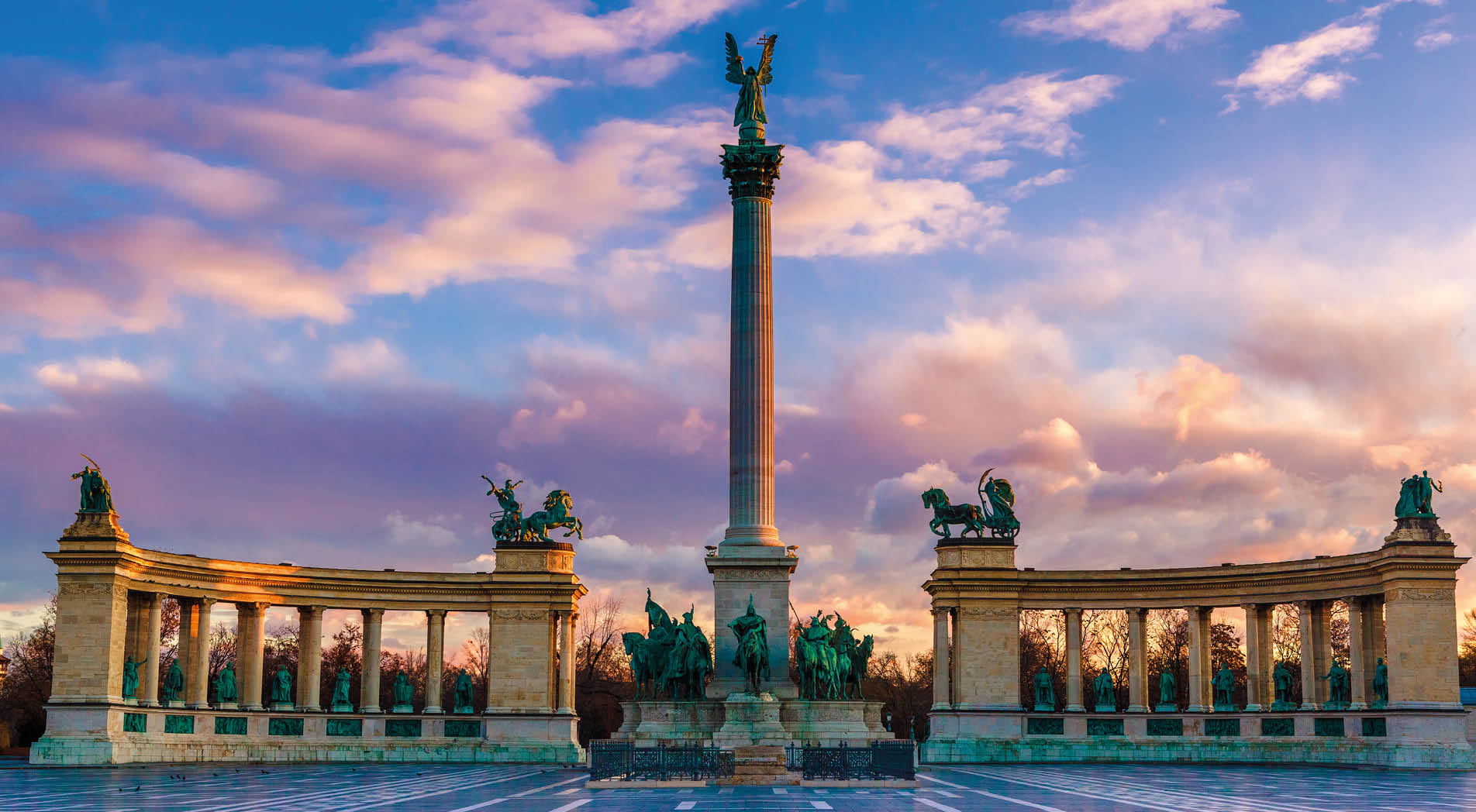 Heroes Square Budapest in morning. The square is the end of Andrassy Avenue, this street is part of Unesco World Heritage. This photo was made after a rain, the reflection is real, not composit image.