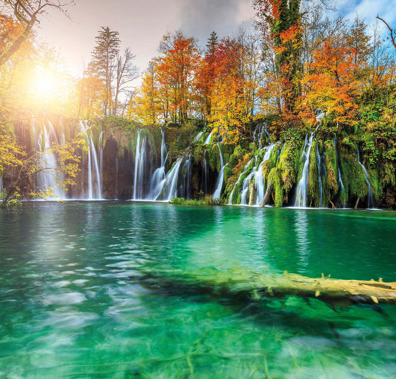 Stunning colorful autumn landscape with spectacular lake and waterfalls in Plitvice lakes National Park, Croatia, Europe